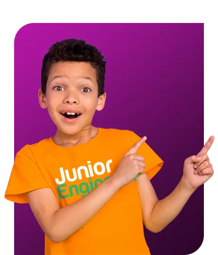 young boy in Junior Engineers shirt pointing